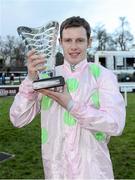 26 December 2012; Jockey Paul Townend holds up the winning trophy after he rode Arvika Ligeonniere, to win the Racing Post Novice Steeplechase. Leopardstown Christmas Racing Festival 2012, Leopardstown Racetrack, Leopardstown, Co. Dublin. Picture credit: Barry Cregg / SPORTSFILE