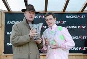 26 December 2012; Jockey Paul Townend and trainer Willie Mullins hold up their winning trophies after they won the Racing Post Novice Steeplechase with Arvika Ligeonniere. Leopardstown Christmas Racing Festival 2012, Leopardstown Racetrack, Leopardstown, Co. Dublin. Picture credit: Barry Cregg / SPORTSFILE