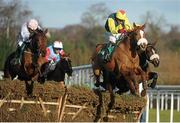 27 December 2012; Flaxen Flare, with Davy Condon up, clears the last ahead of eventual second place Ibsen, with David Splaine up, left, on their way to winning the Paddy Power On Your Mobile 3-Y-O Maiden Hurdle. Leopardstown Christmas Racing Festival 2012, Leopardstown Racetrack, Leopardstown, Co. Dublin. Picture credit: Pat Murphy / SPORTSFILE