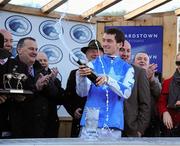 29 December 2012; Jockey Patrick Mullins celebrates after his mount Zuzka won the I.T.B.A Fillies Scheme European Breeders Fund Mares Hurdle. Jockey Patrick Mullins surpassed the previous record, held by Billy Parkinson in 1915, for the most number of winners ridden by an amateur in a calender year in Ireland. Leopardstown Christmas Racing Festival 2012, Leopardstown Racetrack, Leopardstown, Co. Dublin. Picture credit: Pat Murphy / SPORTSFILE