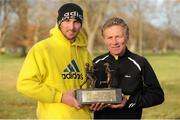 1 January 2013; John Coghlan, Metro St. Brigid's A.C., Dublin, with his father Eamonn Coghlan and the Tom Brennan Memorial Trophy after winning the 2013 Tom Brennan Memorial Trophy 5K Road Race. Phoenix Park, Dublin. Picture credit: Pat Murphy / SPORTSFILE