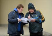 6 January 2013; DCU manager Professor Niall Moyna gives an updated DCU team to Wicklow GAA PRO Pat Mitchell ahead of the game. Bórd na Móna O'Byrne Cup, Group B, Wicklow v DCU. Éire Óg Greystones GAA Club, Greystones, Co. Wicklow. Picture credit: Stephen McCarthy / SPORTSFILE