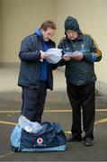6 January 2013; DCU manager Professor Niall Moyna gives an updated DCU team to Wicklow GAA PRO Pat Mitchell ahead of the game. Bórd na Móna O'Byrne Cup, Group B, Wicklow v DCU. Éire Óg Greystones GAA Club, Greystones, Co. Wicklow. Picture credit: Stephen McCarthy / SPORTSFILE