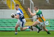 6 January 2013; Denis Booth, Laois, in action against Anton Sullivan, Offaly. Bórd na Móna O'Byrne Cup, Group C, Offaly v Laois, O'Connor Park, Tullamore, Co. Offaly. Picture credit: Barry Cregg / SPORTSFILE