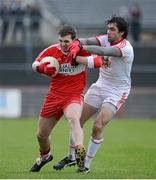 6 January 2013; Ryan Bell, Derry, in action against Joe McMahon, Tyrone. Power NI Dr. McKenna Cup, Section C, Round 1, Tyrone v Derry, Healy Park, Omagh, Co. Tyrone. Picture credit: Oliver McVeigh / SPORTSFILE