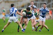 6 January 2013; Richie Dalton, Offaly, in action against David Murphy, left, and Paul Begley, Laois. Bórd na Móna O'Byrne Cup, Group C, Offaly v Laois, O'Connor Park, Tullamore, Co. Offaly. Picture credit: Barry Cregg / SPORTSFILE