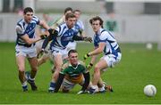 6 January 2013; Ross Brady, Offaly, in action against Brendan Quigley, far left, Paul Begley and Padraig McMahon, right, Laois. Bórd na Móna O'Byrne Cup, Group C, Offaly v Laois, O'Connor Park, Tullamore, Co. Offaly. Picture credit: Barry Cregg / SPORTSFILE