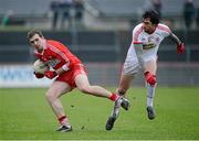 6 January 2013; Ryan Bell, Derry, in action against Joe McMahon, Tyrone. Power NI Dr. McKenna Cup, Section C, Round 1, Tyrone v Derry, Healy Park, Omagh, Co. Tyrone. Picture credit: Oliver McVeigh / SPORTSFILE