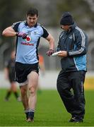 6 January 2013; Dublin captain Michael Darragh McAuley is attended to by Chartered Physiotherapist Kieran O’Reilly. Bórd na Móna O'Byrne Cup, Group B, Carlow v Dublin, Dr. Cullen Park, Carlow. Picture credit: Ray McManus / SPORTSFILE