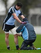 6 January 2013; Dublin captain Michael Darragh McAuley is attended to by Chartered Physiotherapist Kieran O’Reilly. Bórd na Móna O'Byrne Cup, Group B, Carlow v Dublin, Dr. Cullen Park, Carlow. Picture credit: Ray McManus / SPORTSFILE