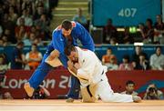 3 August 2012; Andread Toelzer, Germany, white, in action against Alexander Mikhaylin, Russia, during their men's +100kg semi-final. London 2012 Olympic Games, Judo, ExCeL Arena, Royal Victoria Dock, London, England. Picture credit: Stephen McCarthy / SPORTSFILE