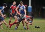 10 January 2013; David Feenan, C.U.S., is tackled by Johnny Guy, St. Andrew's College. Vinny Murray Schools Cup, 1st Round, C.U.S. v St. Andrew's College, Wanderers RFC, Merrion Road, Dublin. Picture credit: Brian Lawless / SPORTSFILE