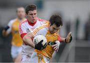 13 January 2013; Kevin Niblock, Antrim, in action against Patrick McNiece, Tyrone. Power NI Dr. McKenna Cup, Section C, Round 2, Antrim v Tyrone, Casement Park, Belfast, Co. Antrim. Picture credit: Oliver McVeigh / SPORTSFILE