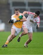 13 January 2013; Tony Scullion, Antrim, in action against Sean Warnock, Tyrone. Power NI Dr. McKenna Cup, Section C, Round 2, Antrim v Tyrone, Casement Park, Belfast, Co. Antrim. Picture credit: Oliver McVeigh / SPORTSFILE