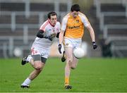 13 January 2013; Sean McCarron, Antrim, in action against Plunkett Kane, Tyrone. Power NI Dr. McKenna Cup, Section C, Round 2, Antrim v Tyrone, Casement Park, Belfast, Co. Antrim. Picture credit: Oliver McVeigh / SPORTSFILE