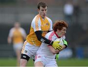 13 January 2013; Peter Harte, Tyrone, in action against Justin Crozier, Antrim. Power NI Dr. McKenna Cup, Section C, Round 2, Antrim v Tyrone, Casement Park, Belfast, Co. Antrim. Picture credit: Oliver McVeigh / SPORTSFILE
