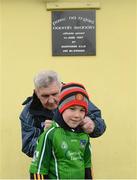 13 January 2013; Aidan O'Malley, age 7, from St. Senan's GAA Club, Foynes, Co. Limerick, has his jersey signed by Clare manager Mick O'Dwyer ahead of the game. McGrath Cup Quarter-Final, Limerick v Clare, Pairc na nGael, Foynes, Co. Limerick. Picture credit: Stephen McCarthy / SPORTSFILE