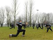 13 January 2013; Tipperary's Shane McGrath warms up before the start of the game against Offaly with his team-mates. Inter-County Challenge Match, Tipperary v Offaly, Templemore, Co. Tipperary. Picture credit: Matt Browne / SPORTSFILE