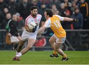 13 January 2013; Jonathan Lafferty, Tyrone, in action against James Laverty, Antrim. Power NI Dr. McKenna Cup, Section C, Round 2, Antrim v Tyrone, Casement Park, Belfast, Co. Antrim. Picture credit: Oliver McVeigh / SPORTSFILE