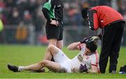 13 January 2013; Sean Cavanagh, Tyrone, receives treatment for a head injury from Michael Harte, Tyrone Physiotherapist. Power NI Dr. McKenna Cup, Section C, Round 2, Antrim v Tyrone, Casement Park, Belfast, Co. Antrim. Picture credit: Oliver McVeigh / SPORTSFILE