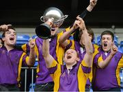 15 January 2013; CBS Wexford captain Collie Joyce Ahearne lifts the cup alongside his team-mates. Senior Development Cup Final, CBS Wexford v Ratoath C.C, Donnybrook Stadium, Donnybrook, Dublin. Picture credit: David Maher / SPORTSFILE