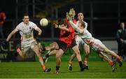 16 January 2013; Paul McComiskey, Down, in action against Gary McCooey and Barry Loughran, Armagh. Power NI Dr. McKenna Cup, Section B, Round 3, Down v Armagh, Pairc Esler, Newry, Co. Down. Picture credit: Oliver McVeigh / SPORTSFILE