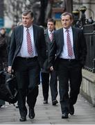 17 January 2013; Munster Team Manager Niall O'Donovan, left, and Munster Rugby Chief Executive Garrett Fitzgerald, right, lead Ronan O'Gara as they arrive for an ERC disciplinary hearing following an incident between O'Gara and Edinburgh's Sean Cox during last Sunday's Heineken Cup, Pool 1, Round 5, game in Murrayfield. ERC Offices, Hugenot House, St. Stephen's Greeen, Dublin. Picture credit: Barry Cregg / SPORTSFILE