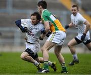 20 January 2013; Sean Johnston, Kildare, in action against Woin Carroll, Offlay. Bórd na Móna O'Byrne Cup, Semi-Final, Offaly v Kildare, O'Connor Park, Tullamore, Co. Offaly. Picture credit: David Maher / SPORTSFILE