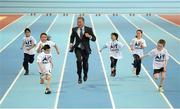23 January 2013; Former world 5,000m gold medallist Eamonn Coghlan and 3rd class pupils, from Cornamaddy National School, Athlone, Co. Westmeath, from left, Zaryab Zeb, age 9, Stephanie Siak, age 9, Kayri Kajani, age 9, Yasmin Nur, age 10, Alexiane Parker, age 9, and Caimin Boland, age 8, test out the track during a media tour of the Athlone Institute of Technology International Arena. The €10 million facility has a footprint of 6,818m² and an overall building floor area of 9,715m². Some 850 tonnes of structural steel and 50,000 concrete blocks went into the construction of the facility which can house 2,000 spectators. The official opening of the arena will take place next month, prior to the hosting of the Athletics Ireland Senior Indoor Championships on 16-17 February. Athlone Institute of Technology, Athlone, Co. Westmeath. Picture credit: Stephen McCarthy / SPORTSFILE