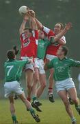 22 March 2003; John Quane, Limerick, goes up for a high ball with Seamus O'Hanlon, and Martin Farrelly, Louth. Allianz National Football League Division 2A, Louth v Limerick, Pairc Mhuire, Ardee, Co. Louth. Picture credit; Damien Eagers / SPORTSFILE *EDI*