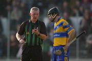 23 March 2003; Frank Lohan, Clare, is booked by referee Pat Ahern. Allianz National Hurling League, Division 1A, Kilkenny v Clare, Nowlan Park, Kilkenny. Picture credit; Ray McManus / SPORTSFILE *EDI*