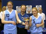 26 March 2003; Presentation Thurles, co-captains, Susan Fogarty, (10), and Mandy Fennessy are presented with the cup by Paul Ryan, President of the Schools Basketball Assicoation of Ireland. TREBOR 24-7 All-Ireland Schools Basketball Girls Senior &quot;A&quot; Final, Presentation, Thurles, Co. Tipperary v St Mary's Secondary School, Mallow, Cork, ESB Arena, Tallaght, Dublin. Picture credit; Brendan Moran / SPORTSFILE *EDI*