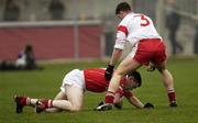 6 April 2003; Michael O'Cronin, Cork, in action against Tyrone's, Colin Holmes. Allianz National Football League, Division 1A, Tyrone v Cork, O'Neill Park, Dungannon, Co. Tyrone. Football. Picture credit; Damien Eagers / SPORTSFILE *EDI*
