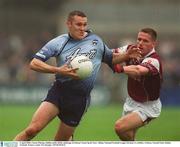 6 April 2003; Ciaran Whelan, Dublin, holds off the challenge of Galway's Sean Og De Paor. Allianz National Football League Division 1A, Dublin v Galway, Parnell Park, Dublin. Football. Picture credit; Pat Murphy / SPORTSFILE