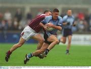 6 April 2003; Jonathan Magee, Dublin, is tackled by Galway's Sean Og De Paor. Allianz National Football League Division 1A, Dublin v Galway, Parnell Park, Dublin. Football. Picture credit; Pat Murphy / SPORTSFILE