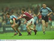 6 April 2003; Brian Cullen, Dublin, helped out by Darren Homan (right), is tackled by Galway's Sean Og De Paor. Allianz National Football League, Division 1A, Dublin v Galway, Parnell Park, Dublin. Picture credit; Ray McManus / SPORTSFILE