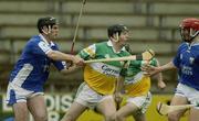 13 April 2003; Joe Errity, Offaly, in action against Patrick Cuddy, left, and Michael McEvoy, Laois. Allianz National Hurling League, Division 1, St Brendan's Park, Birr, Co. Offaly. Picture credit; Brendan Moran / SPORTSFILE *EDI*