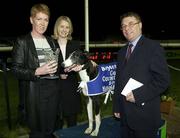 11 April 2003; Pictured at the presentation after Topofthebest had won the Boylesports Corn Cuchulainn Final are Owner Sandra Raleigh, left, Ana Martin, Marketing Manager, Boylesports and Danny McNally , Trading Manager, Boylesports. Harold's Cross Greyhound Stadium, Harold's Cross, Dublin. Greyhond Racing Picture credit; Ray McManus / SPORTSFILE *EDI*