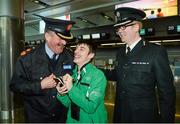 25 January 2013; Role reversal.... Special Olympics Team Ireland athlete Brendan O'Sullivan, from Mallow, Cork, notes the names of Nacie Rice, Deputy Commissioner An Garda Siochana, and Will Kerr, Assistant Chief Constable, PSNI, ahead of his departure to South Korea where he and his team-mates will compete at the 2013 Special Olympics World Winter Games from the 29th of January to the 5th of February. To follow Team Ireland’s progress at these Games visit www.specialolympics.ie/wintergames. Dublin Airport, Dublin. Picture credit: Ray McManus / SPORTSFILE