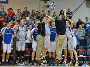 25 January 2013; Bord Gáis Neptune players and team officals celebrate victory after the final buzzer sounds. 2013 Nivea for Men's Superleague National Cup Final, Bord Gáis Neptune v UL Eagles, National Basketball Arena, Tallaght, Dublin. Picture credit: Barry Cregg / SPORTSFILE
