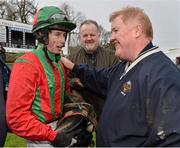 26 January 2013; Owners Adrian Shiels, right, and Niall Reilly with jockey Bryan Cooper after Benefficient won the Frank Ward Solicitors Arkle Novice Steeplechase. Leopardstown Racecourse, Leopardstown, Co. Dublin. Picture credit: Brendan Moran / SPORTSFILE