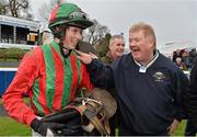 26 January 2013; Co-owner Adrian Shiels with jockey Bryan Cooper after Benefficient won the Frank Ward Solicitors Arkle Novice Steeplechase. Leopardstown Racecourse, Leopardstown, Co. Dublin. Picture credit: Brendan Moran / SPORTSFILE