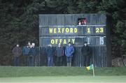 27 January 2013; Scoreboard officials and supporters alike watch as the last point of the game is scored in the last minute. Wexford ultimately finished with 2-24. Bórd na Móna Walsh Cup, Second Round, Wexford v Offaly, Wexford v Offaly, Pairc Naomh Brid, Blackwater GAA Club, Co. Wexford. Picture credit: Ray McManus / SPORTSFILE