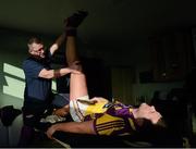 27 January 2013; The Wexford Physical Therapist and Acupuncturist Dolan O'Connor works on Richie Kehoe's hamstring during half time. Bórd na Móna Walsh Cup, Second Round, Wexford v Offaly, Wexford v Offaly, Pairc Naomh Brid, Blackwater GAA Club, Co. Wexford. Picture credit: Ray McManus / SPORTSFILE