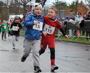 27 January 2013; Senan Murphy, left, and Billy Moore, both age six, from North Bay Educate Together National School, Kilbarrack, Co. Dublin, competing in the AXA Raheny 5 Mile Road Race 2013. Raheny, Dublin. Picture credit: Tomas Greally / SPORTSFILE