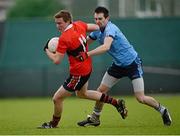 29 January 2013; Brian Coughlan, UCC, in action against Gerard McCartan, UUJ. Irish Daily Mail Sigerson Cup, Round 1, UCC v UUJ, Parnells GAA Club, Coolock, Dublin. Picture credit: Brian Lawless / SPORTSFILE