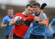 29 January 2013; Kevin O'Driscoll, UCC, in action against Sam Dooney, UUJ. Irish Daily Mail Sigerson Cup, Round 1, UCC v UUJ, Parnells GAA Club, Coolock, Dublin. Picture credit: Brian Lawless / SPORTSFILE