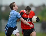 29 January 2013; Tom Clancy, UCC, in action against David Lavery, UUJ. Irish Daily Mail Sigerson Cup, Round 1, UCC v UUJ, Parnells GAA Club, Coolock, Dublin. Picture credit: Brian Lawless / SPORTSFILE