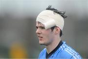 29 January 2013; Carl McKeigue, UUJ, watches the match as he gets his head bandaged following an injury. Irish Daily Mail Sigerson Cup, Round 1, UCC v UUJ, Parnells GAA Club, Coolock, Dublin. Picture credit: Brian Lawless / SPORTSFILE