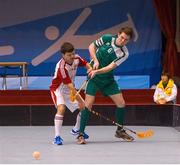 30 January 2013; Team Ireland's Joseph McCarthy, from, Midleton, Co. Cork, in action against Markus Hummel, Switzerland. Match 1, Division 2, Ireland v Switzerland. 2013 Special Olympics World Winter Games, Floorball, Gangneung Indoor Sports Center, Gangneung, South Korea. Picture credit: Ray McManus / SPORTSFILE